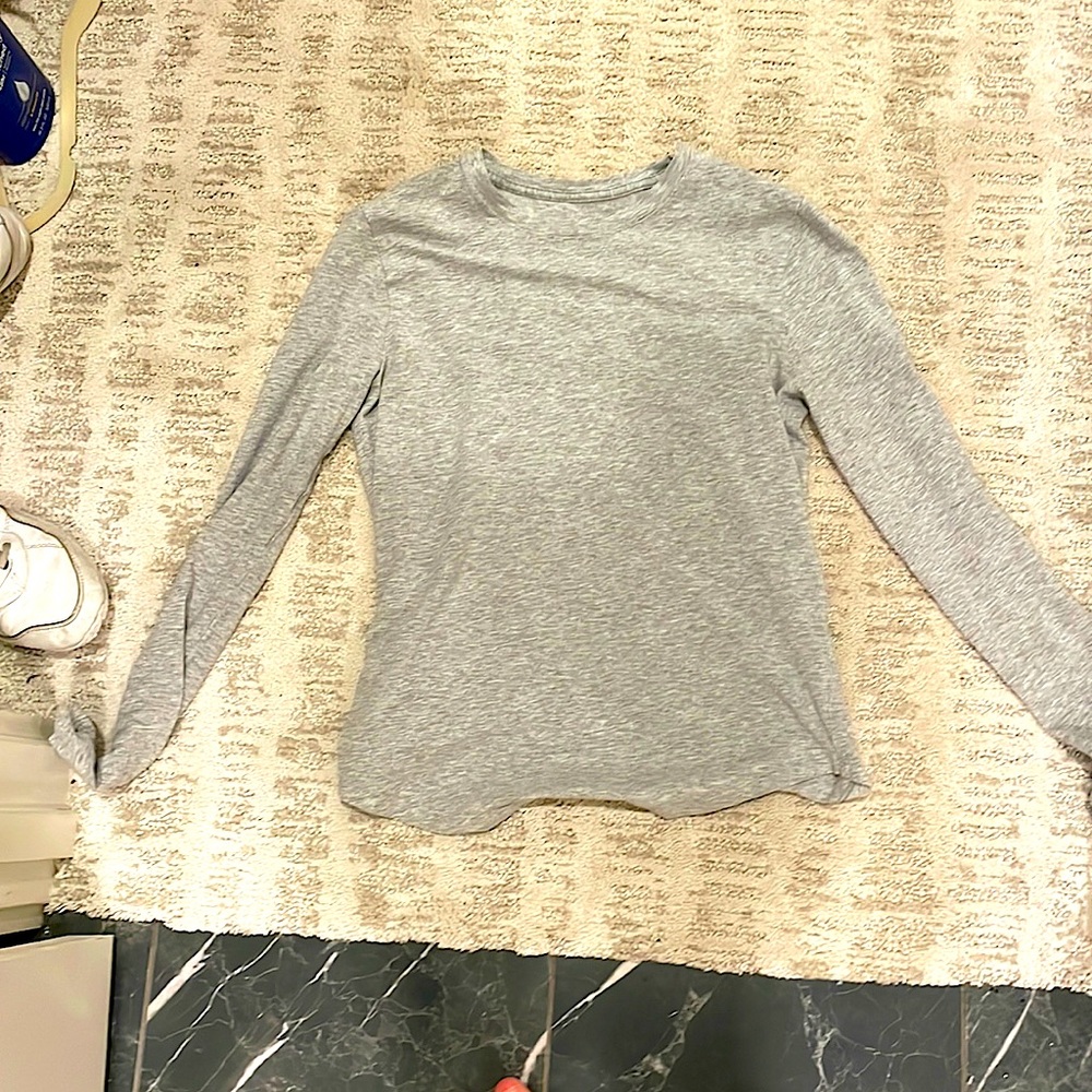 A old gray long sleeve wanting to be bought so please by me
